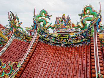 Low angle view of multi colored temple against sky