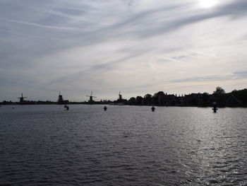 Scenic view of sea against sky in city