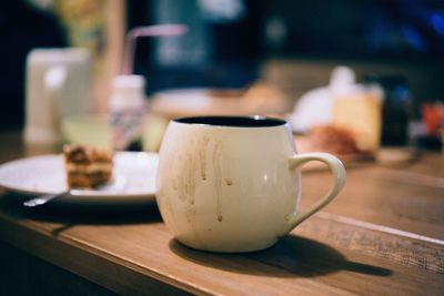 Close-up of coffee cup on table