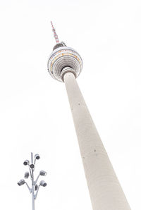 Low angle view of communications tower against sky