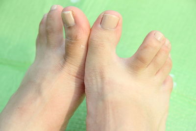 Child toes with green background