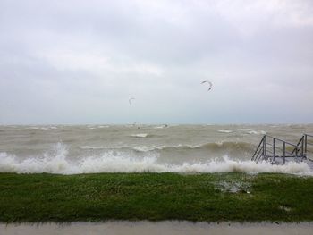 Scenic view of sea against cloudy sky