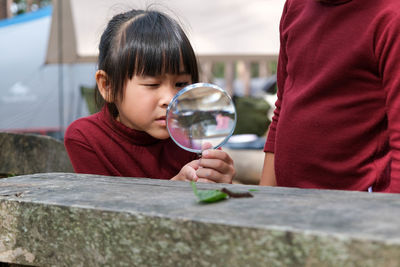 Portrait of young woman blowing bubbles