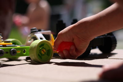 Close-up of child playing with toy