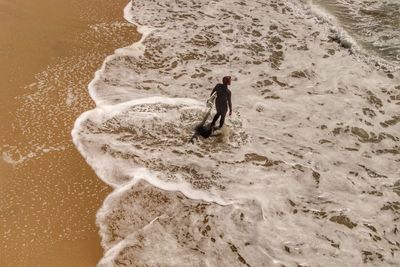 High angle view of surfer at beach