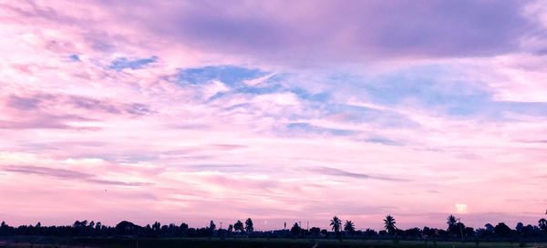 Silhouette landscape against sky at sunset