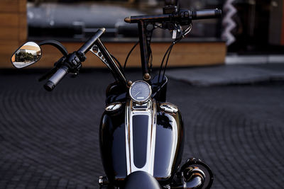 Close-up of motorcycle on street