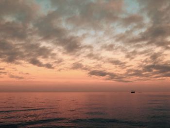 Scenic view of sea against sky at sunset