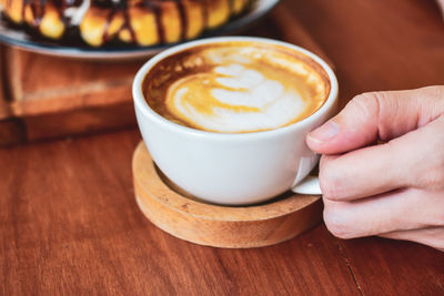 High angle view of coffee cup on table