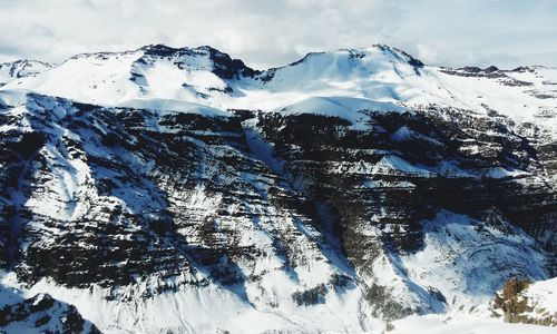 Snow covered mountains against sky