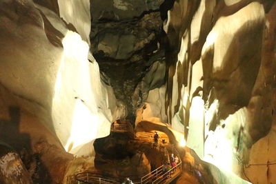 Low angle view of illuminated cave