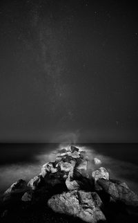 Scenic view of sea against sky at night