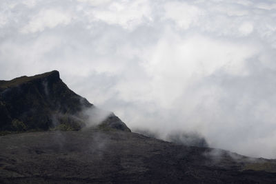 Scenic view of volcanic mountain against sky