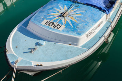 High angle view of sailboats moored in sea