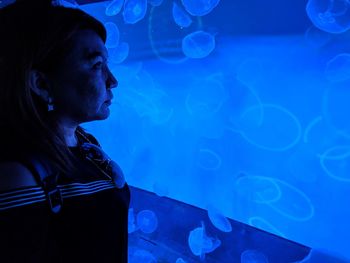 Woman looking at aquarium