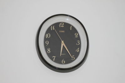 Close-up of clock on wall