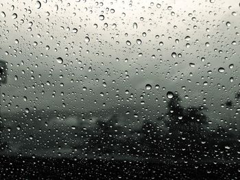 Close-up of water drops on glass