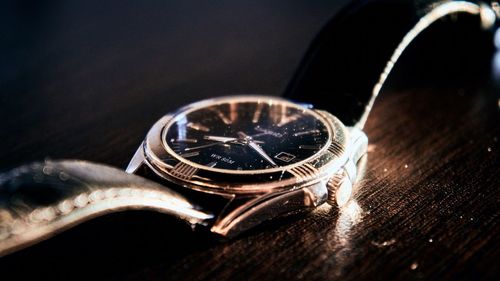 High angle view of clock on table