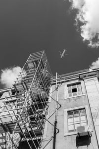 Low angle view of airplane flying in sky