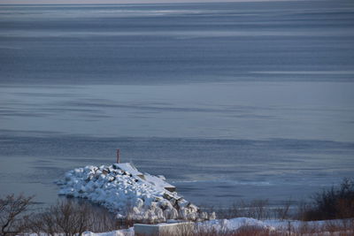 Scenic view of sea against sky during winter