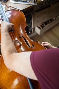 Close-up of man playing guitar