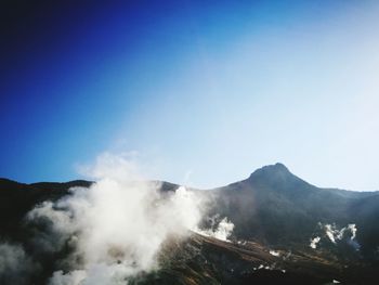 Scenic view of mountains against clear sky