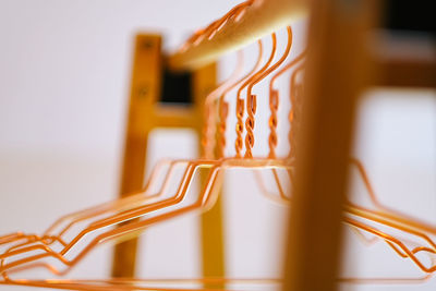 Close-up of electric lamp on table against white background