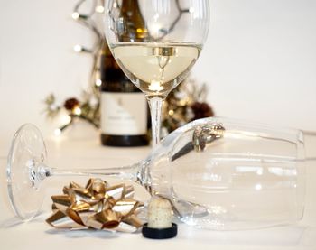 Close-up of wine glasses on table