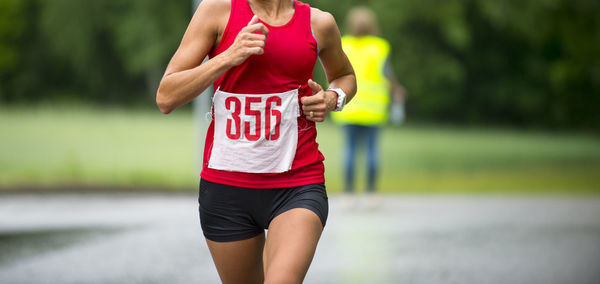 Midsection of woman running