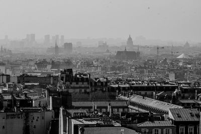 High angle view of buildings in city against sky