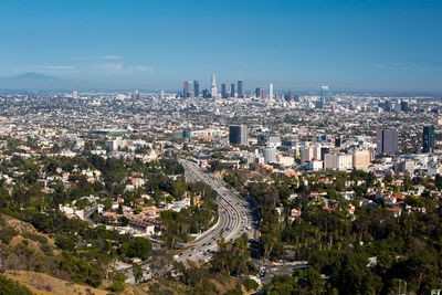 High angle view of buildings in city against sky