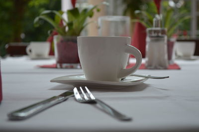 Close-up of coffee cup on table