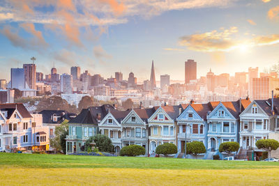 Buildings against sky during sunset