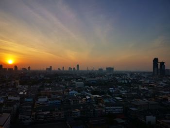 High angle view of buildings against sky during sunset