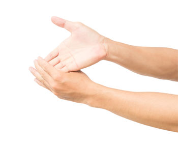 Close-up of woman hand over white background