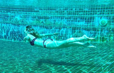 Woman swimming in pool