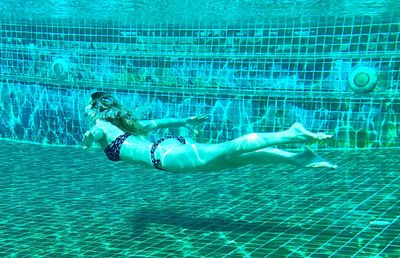 Woman swimming in pool