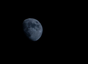 Low angle view of moon against clear sky at night