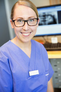 Portrait of smiling dentist