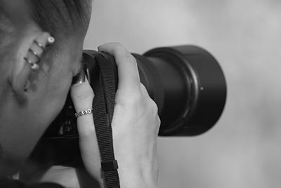 Close-up of man holding camera