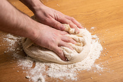 Midsection of person preparing food on table