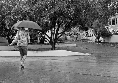 Woman walking in swimming pool