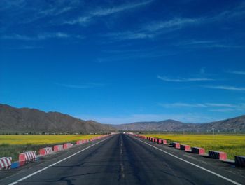 Country road with mountains in background