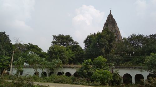 View of temple against cloudy sky