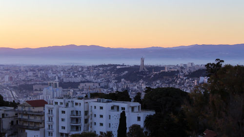 High angle view of townscape against sky during sunset