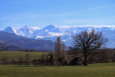 Scenic view of snowcapped mountains against sky