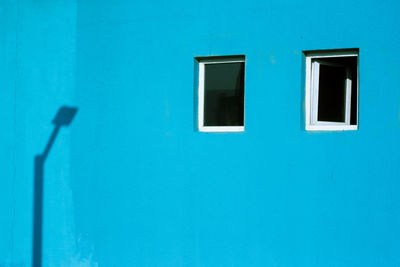 Exterior of blue house during sunny day