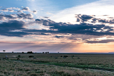 Scenic view of landscape against sky during sunset