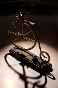 High angle view of penny-farthing bicycle show piece on table