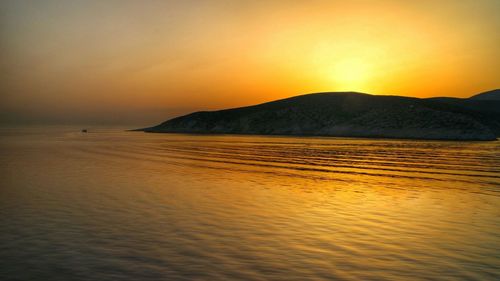Scenic view of sea at sunset